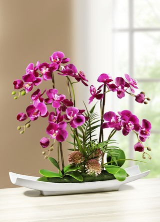 Orchideeënbloemstuk in schaal