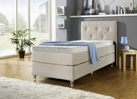 Boxspring bed met gewatteerde hoofdeinde
