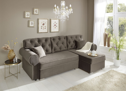 Hoekbank met slaapfunctie en decoratieve kussens