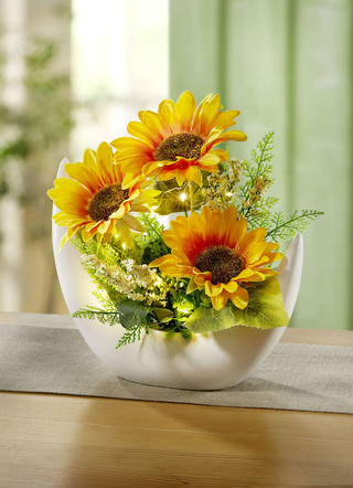 Verlicht zonnebloem arrangement