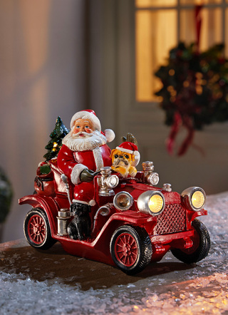 Kerstman met oldtimer van kunsthars