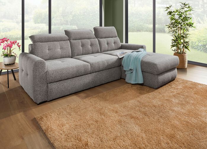 Gestoffeerde hoek met bedfunctie en bedkast 