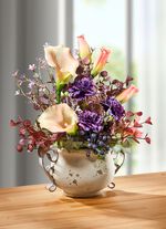 Calla arrangement in een pot met een handvat 