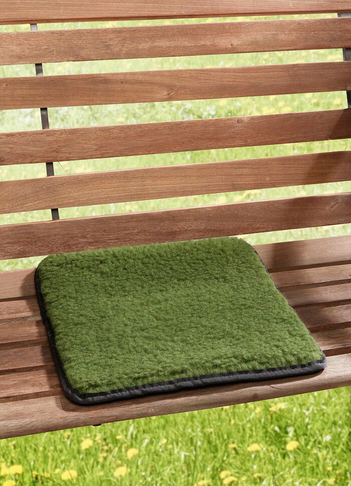 Oprolbaar scheerwollen zitkussen 