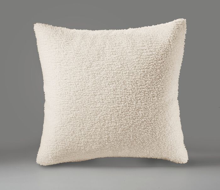 Dekens en kussens met een donzige, zachte teddy voorkant 