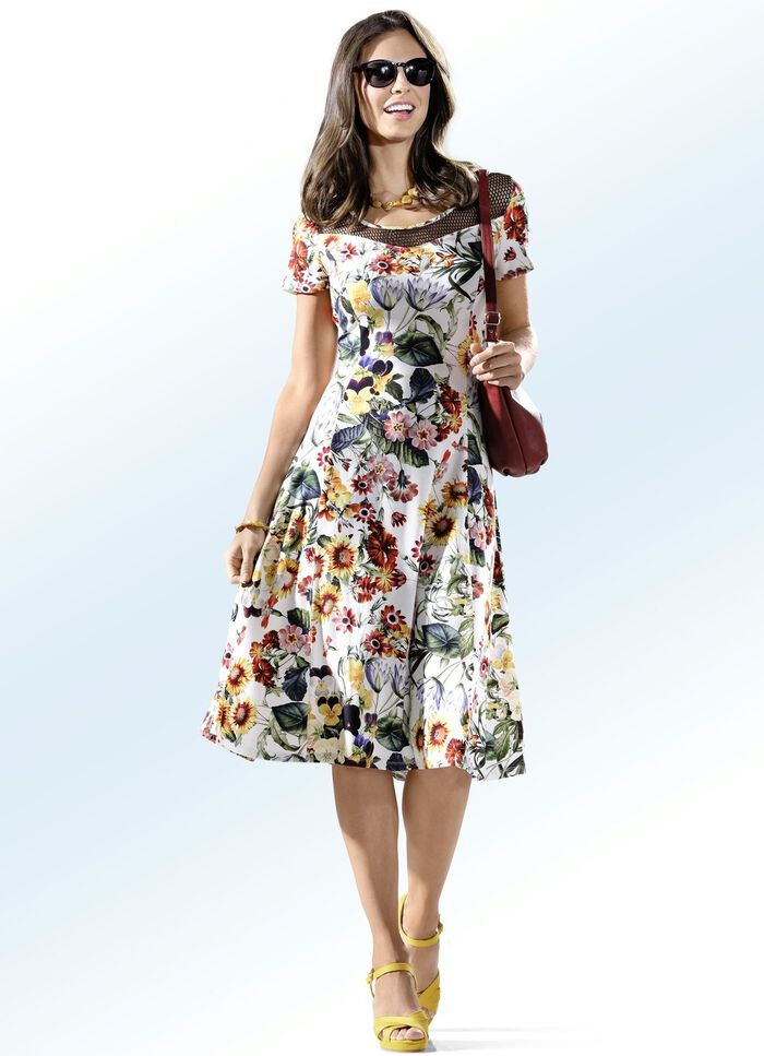 Jurk met extravagant netinzetstuk 