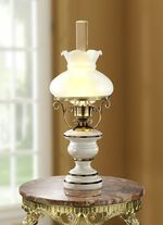 Tafellamp van ijzer en hout en afgewerkt met messing 