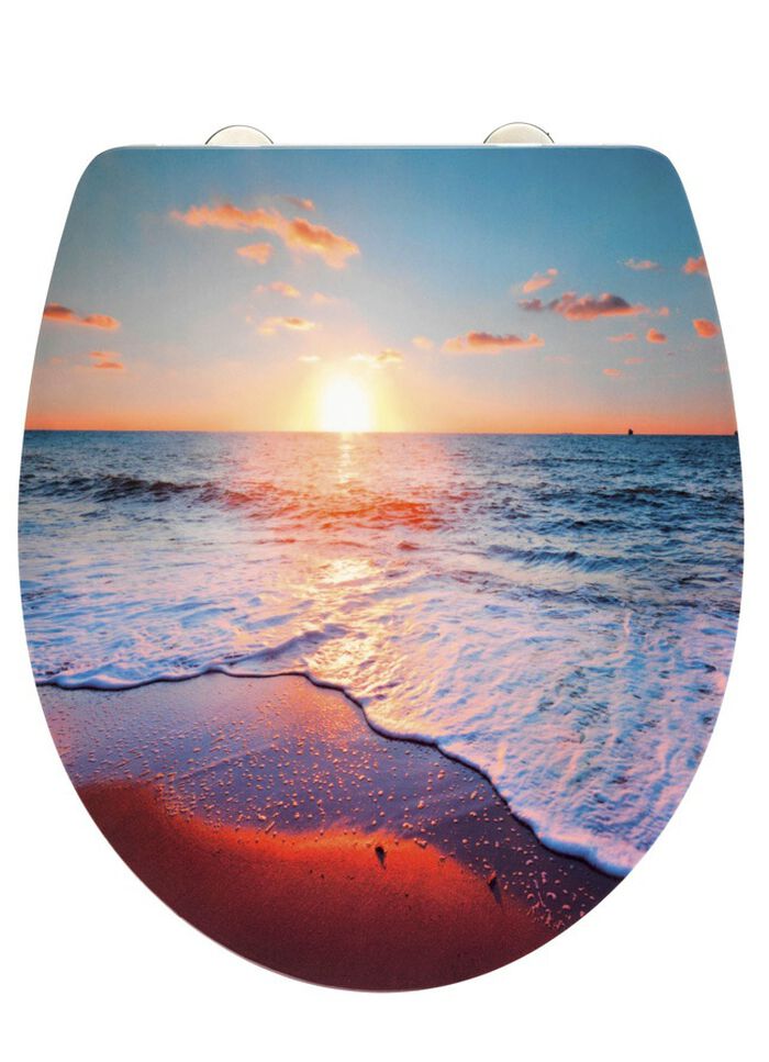 Toiletdeksel met mooi motief van een zonsondergang aan zee 