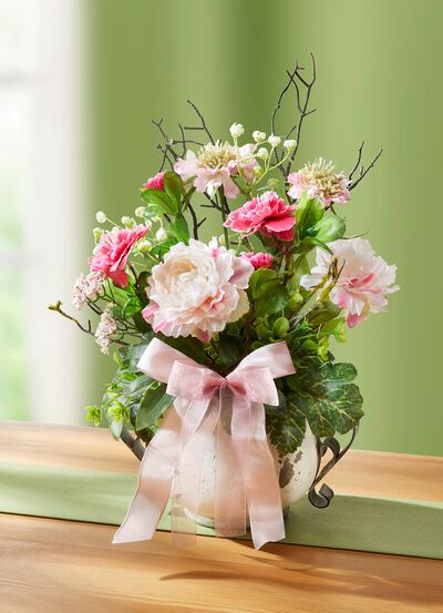 Bloemstuk in een pot met handvat 