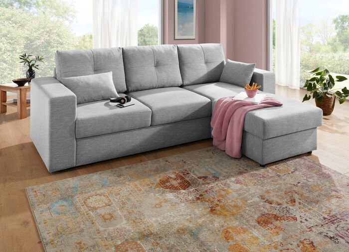 Gestoffeerde hoek met bedfunctie en bedkast die vrij in de kamer kan worden opgesteld 