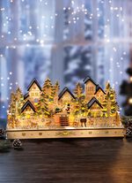 Verlicht houten winterdorp 