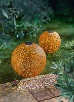 Zonnebol van roestkleurig metaal 