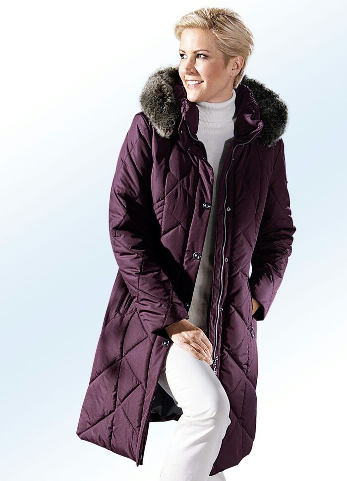 Mantel met figuurstrelende naden 