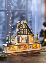 Verlicht houten boshuis 