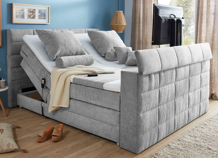Boxspringbed met elektrisch uitschuifbare tv-beugel 
