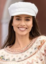 Elegante dames krantenjongenspet met elastiek aan de achterkant 