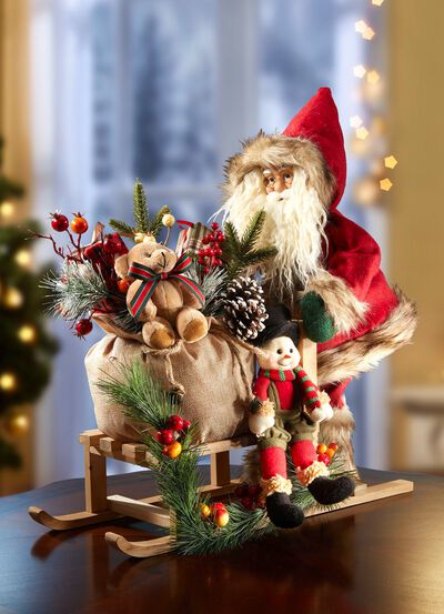 De Kerstman op een houten slee 