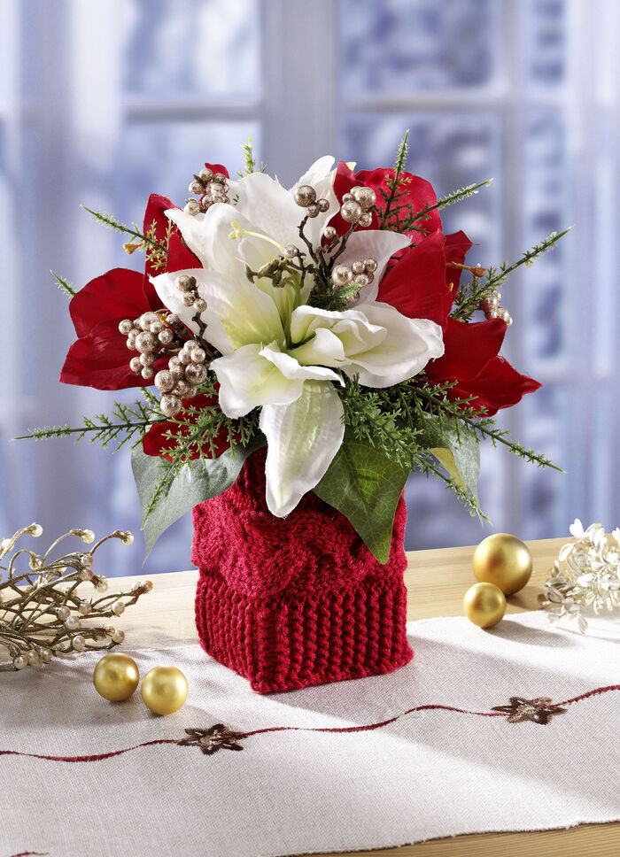 Arrangement met rode en witte poinsettiabloemen 
