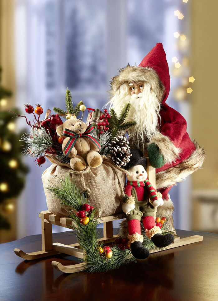 De Kerstman op een houten slee 