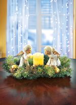 Tafelbloemstuk met echte waskaarsen met LED 