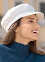 Elegante dames krantenjongenspet met elastiek aan de achterkant 