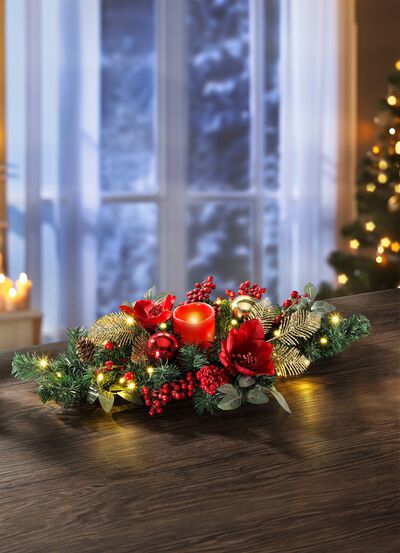 Tafelbloemstuk met echte waskaarsen met LED 