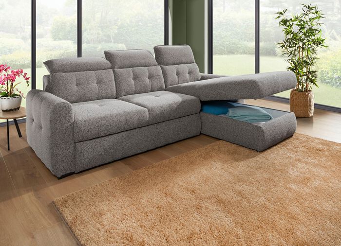 Gestoffeerde hoek met bedfunctie en bedkast 