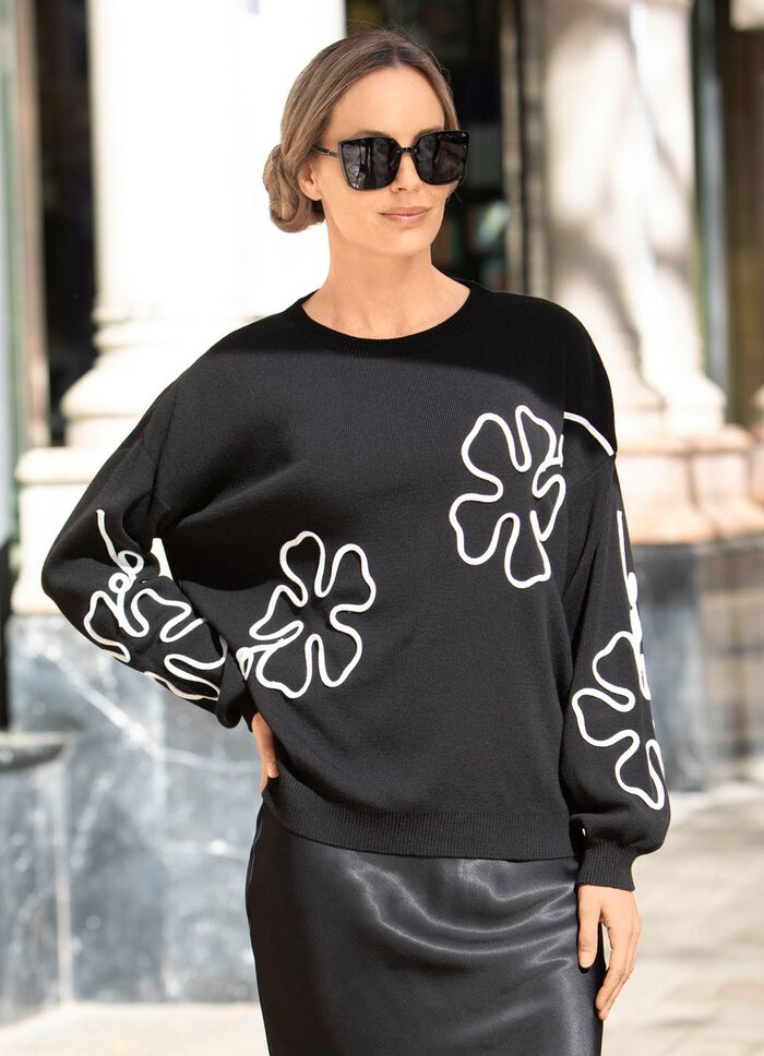 Trui met uitgebreide bloemapplicaties 