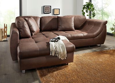 Vrijstaande gestoffeerde hoekbank met bedfunctie 