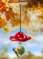 Meesbalhouder in de vorm van een vliegenzwam 