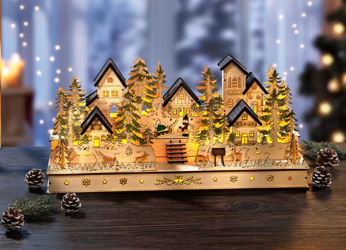 Verlicht houten winterdorp 