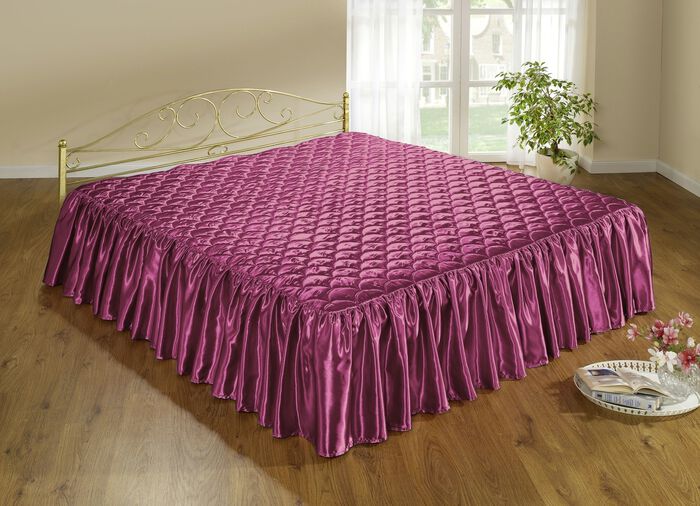 Elegante, glanzende sprei en kussenslopen met quilting in schelplook 