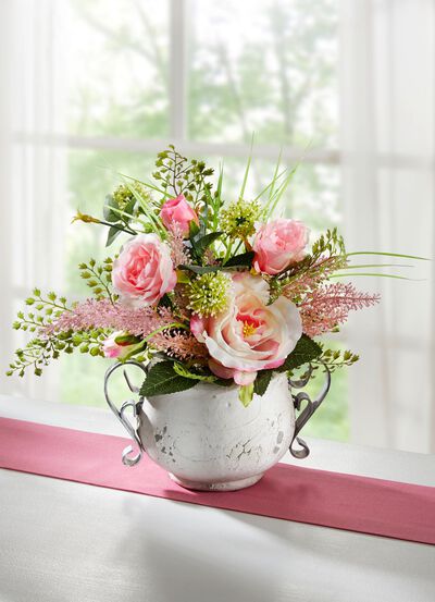 Arrangement in pot gemaakt van kunst- en textielmateriaal 