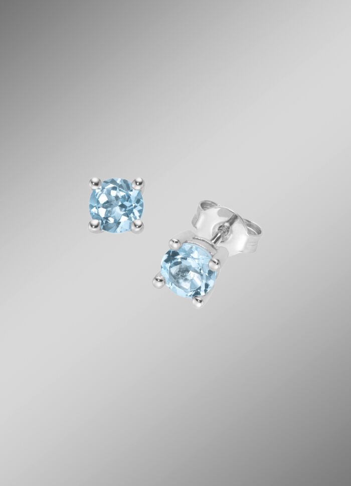 Tijdloze elegantie: Oorknopjes met ring. blauwe topaas 