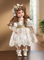 Porseleinen pop met feestelijke kleding 