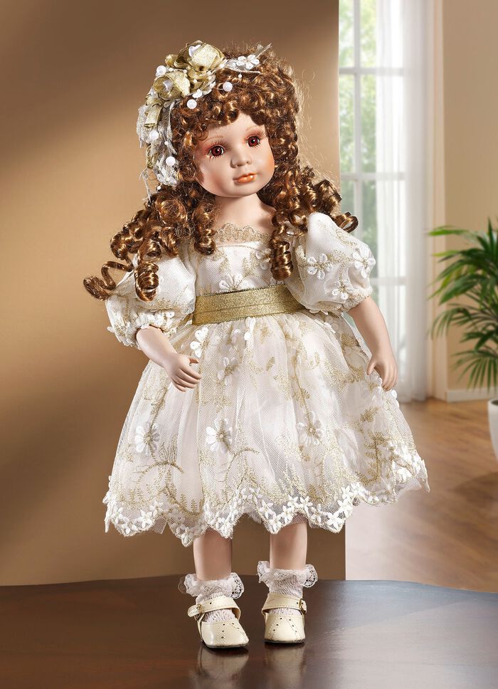 Porseleinen pop met feestelijke kleding 