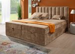 Boxspringbed met individuele hoofdbordverstelling en sierkussens 
