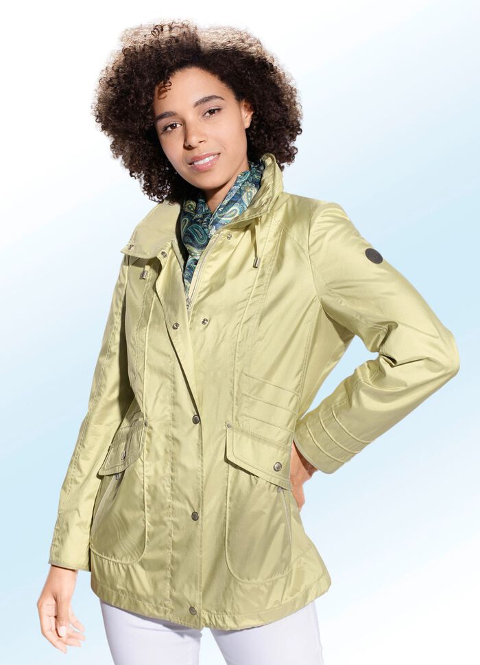 Jas in 2 kleuren met capuchon die in de kraag kan worden opgeborgen PISTACHE