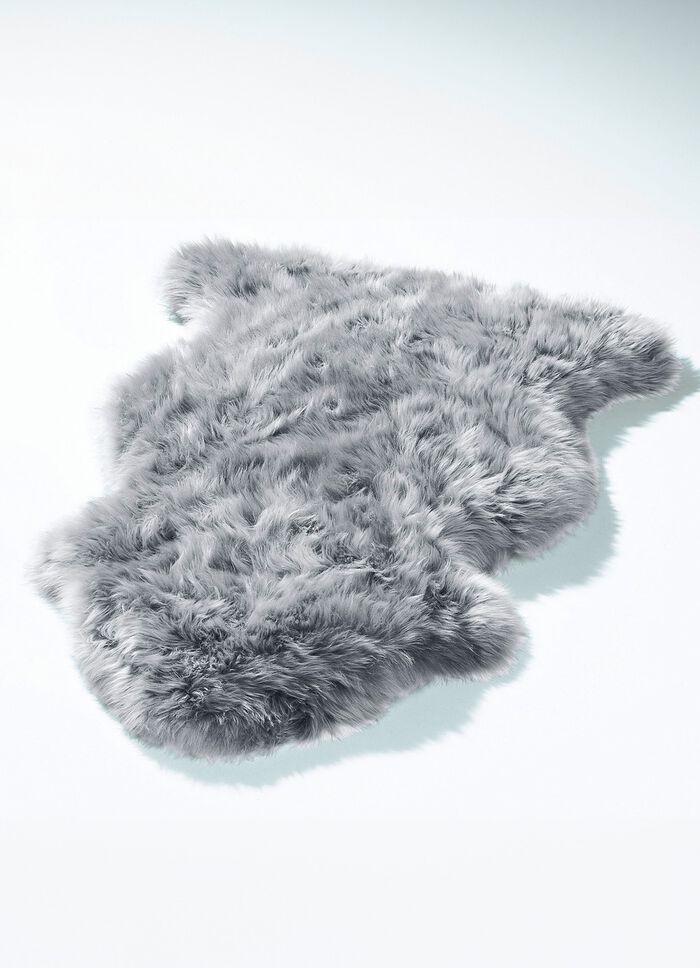 Mat van echte lamsvacht in dierenvorm 