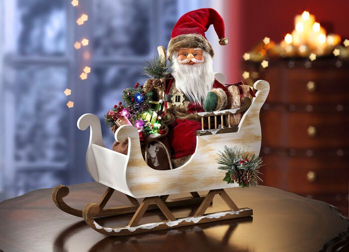 Verlichte kerstman met arreslee 