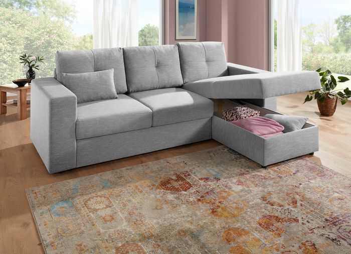 Gestoffeerde hoek met bedfunctie en bedkast die vrij in de kamer kan worden opgesteld 