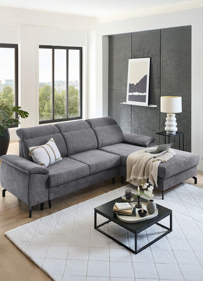 Gestoffeerde hoek met bedfunctie en bedkast 