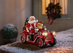 Kerstman met oldtimer van kunsthars 