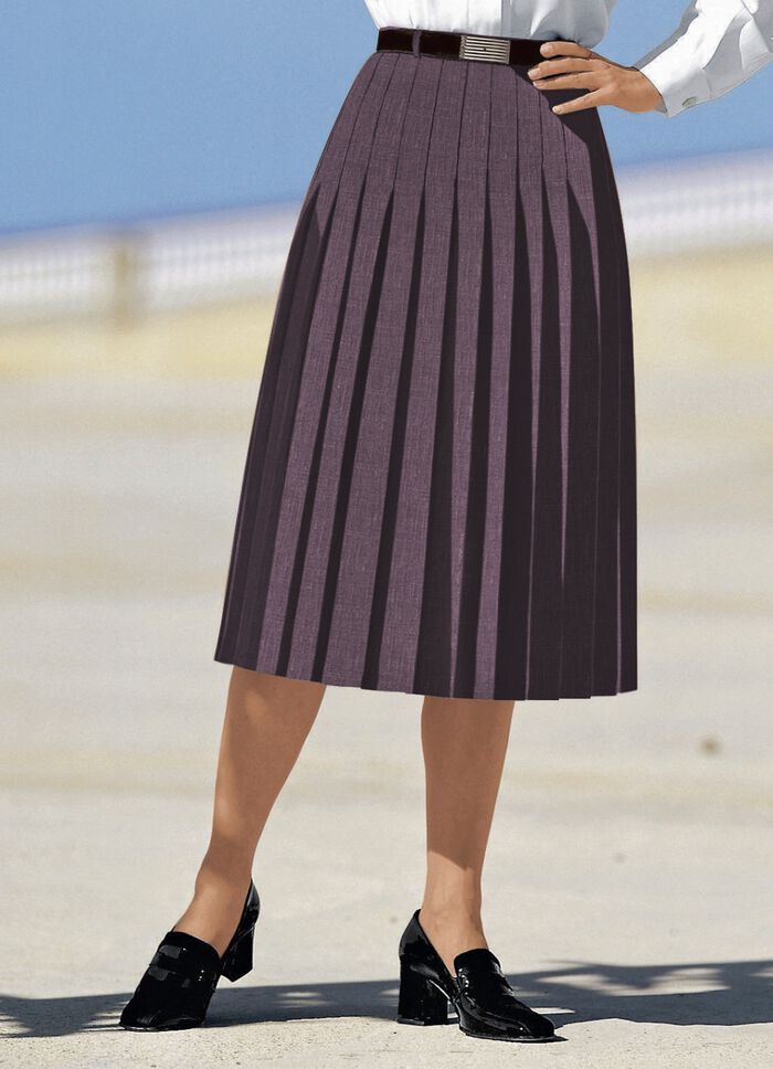 Rok met figuurstrelende plooien rondom BRAAM