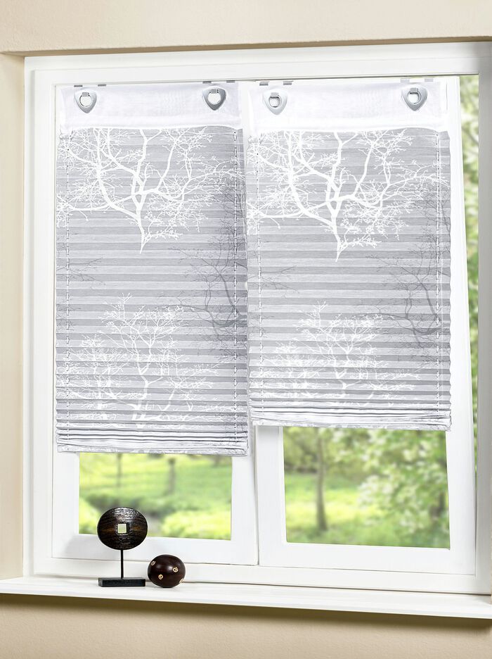 Plisségordijnen met decoratieve printontwerpen 