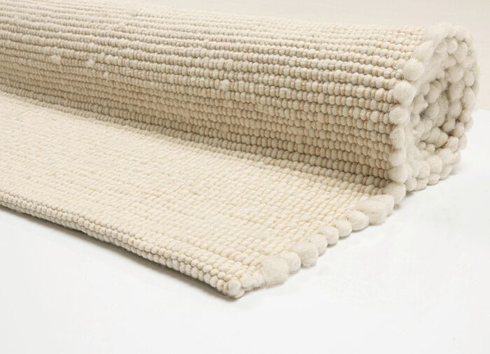 Handgeweven bruggen en tapijten van scheerwol 