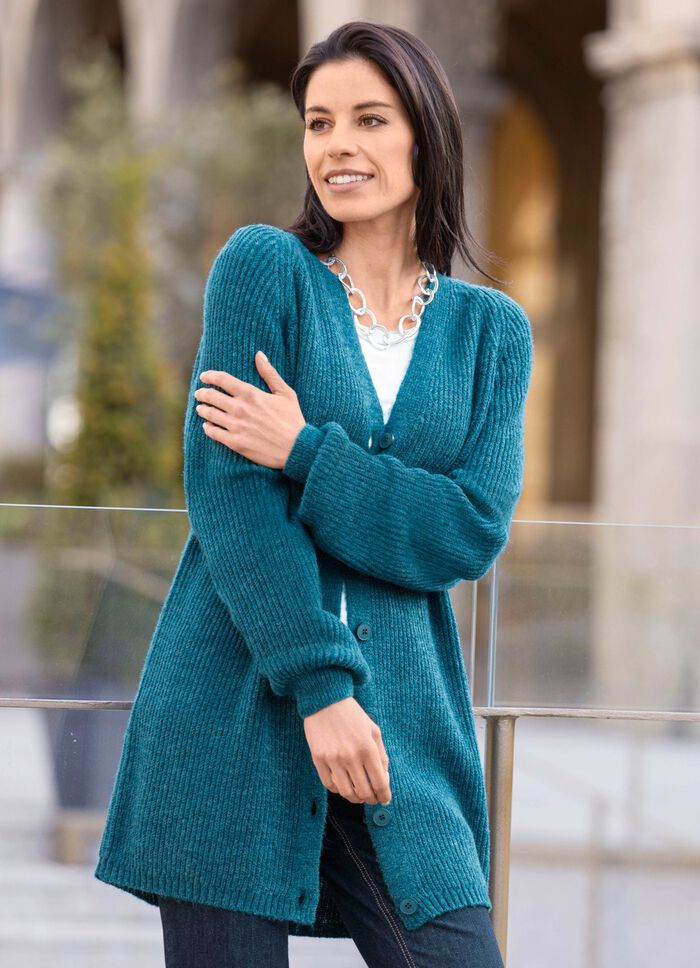 Lange cardigan met parelkwastje 