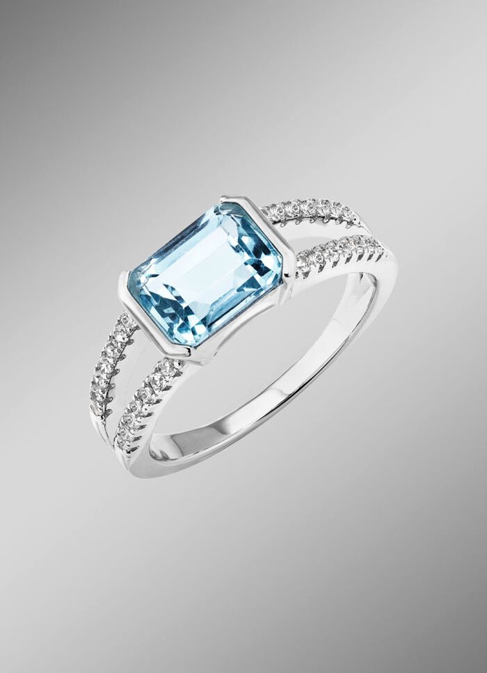 Elegantie ontmoet tijdloosheid: damesring met blauwe topaas en synthetische zirkonia 