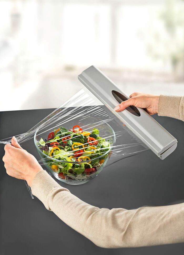 Foliedispenser met veermechanisme 